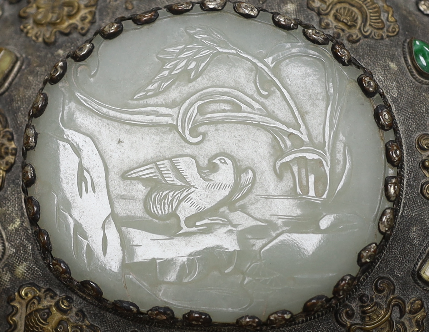 A Chinese celadon jade mounted hand mirror, the jade 18th/19th century